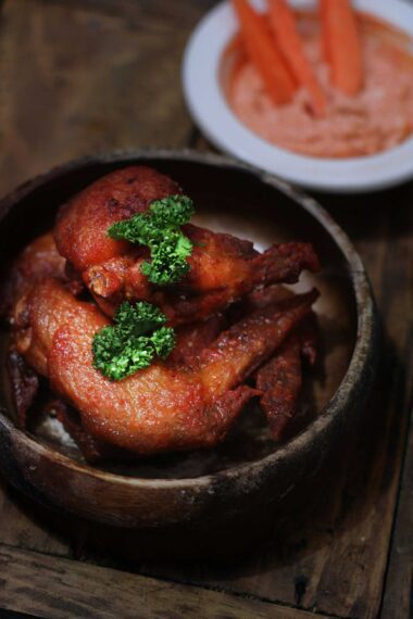 fried chicken in brown wooden bowl